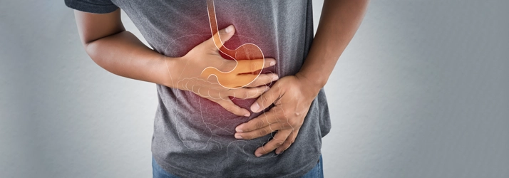 Chiropractic Lawrenceville GA Man With Stomach Pain